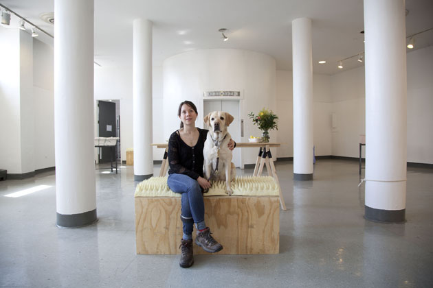 A picture of me sitting with my arm around my guide dog London