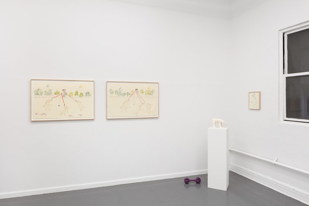 An installation view showing two London Midsummer drawings side-by-side and two ceramic sculptures of dog gear and toys - displayed on pedestals, the wall, and the floor.
