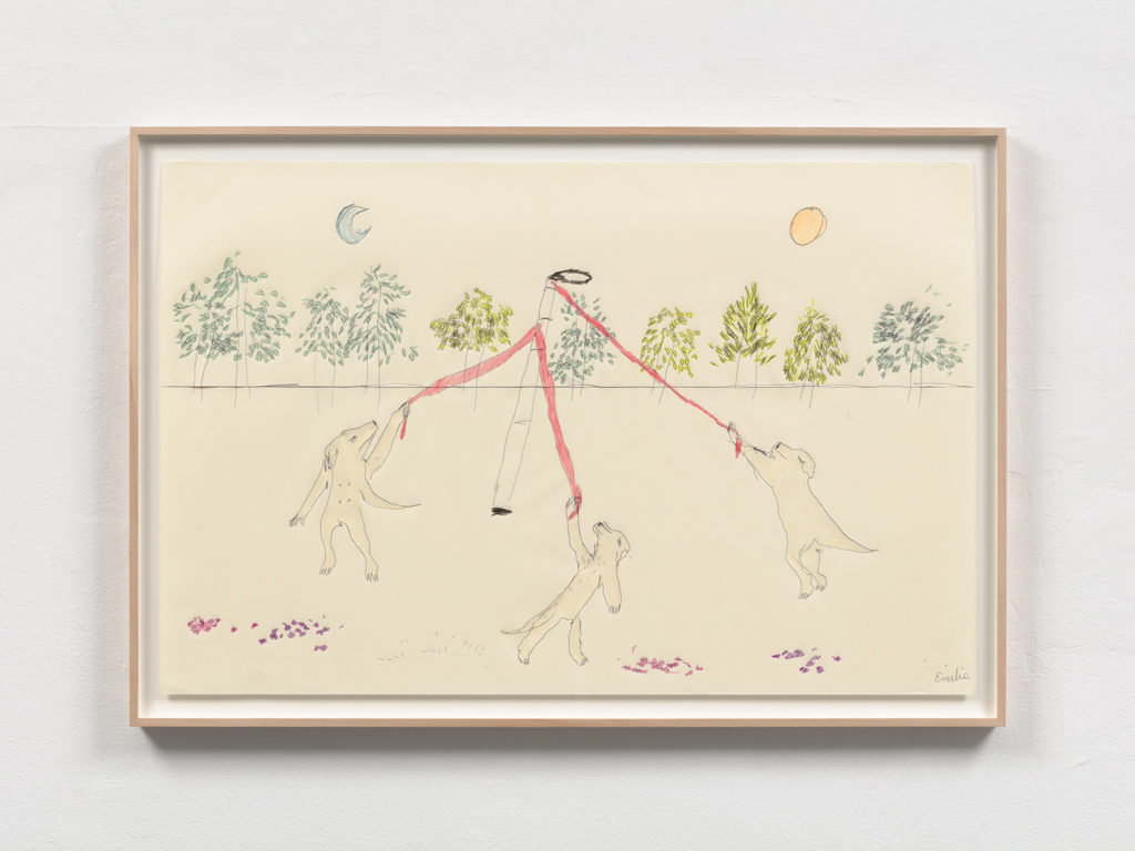 A landscape drawing of three golden Labrador Retrievers with human arms and hands dancing on their hind legs around a Maypole, which raises out from the ground in the center of the drawing. The Maypole is drawn to resemble my extendable white cane, with a cane tip, and a black looped handle. There are three pink dog leashes coming out from the top of the white cane maypole, which each dog holds onto as they circle around it. There are trees in the background, above the trees in the sky is a pale blue crescent moon at the top left, and an yellow orange sun in the top right. There are red flowers on the ground, and the colors of the trees feels like the birth of spring.