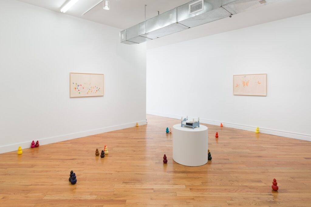 Installation shot of "Kong Play", taken from the opposite side of "Moon Bed", showing that even more Kongs are installed throughout the gallery. There are two drawings installed on the walls in the background, "Pleasure Palace" on the left and “Angel Dogs Flying to the Moon” to the right.