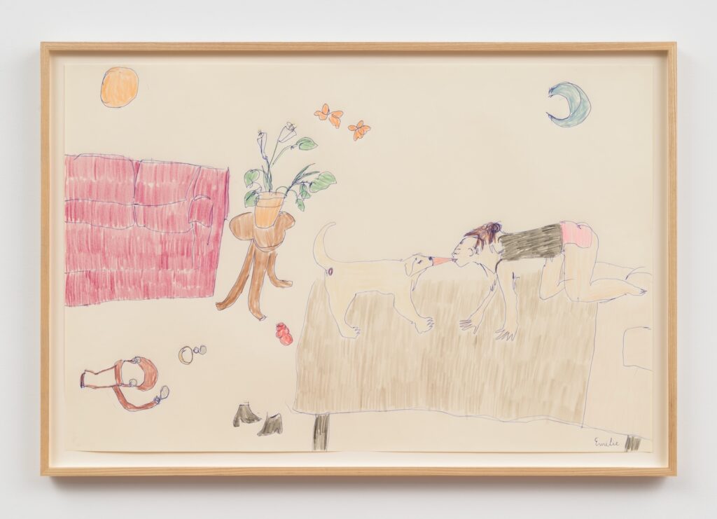 "Wild Girls" is a colorful drawing on off-white paper, framed in a light wood frame. The scene is in a bedroom, drawn in a playful, whimsical style. On the right side, Emilie, with brown hair in a bun, and wearing a black tank top and pink underwear, is positioned on all fours on a bed. Emilie’s face is close to London's, an English Labrador Retriever, also on the bed, with their tongues affectionately licking each other. Emilie’s fingers are splayed on the bed, and their knees are bent, with one leg stretching back. To the left of the bed, there is a small round wooden table with three legs. On top of the table sits a potted plant with green leaves and white flowers. Above the plant, two orange butterflies are drawn in mid-air. Further left, a red couch with simple, vertical and horizontal lines indicating cushions sits against the wall. The couch is colored in with red and pink strokes, giving it a textured appearance. On the floor, and strewn about, is London’s Guide Dog harness, her brown dog leash, and her collar. Closer to the center, a pair of black ankle boots is placed side by side, and a red Kong chew toy is nearby. At the top left, there is an orange circle representing the sun, and at the top right, a pale blue crescent moon, adding a surreal or imaginative touch to the scene.