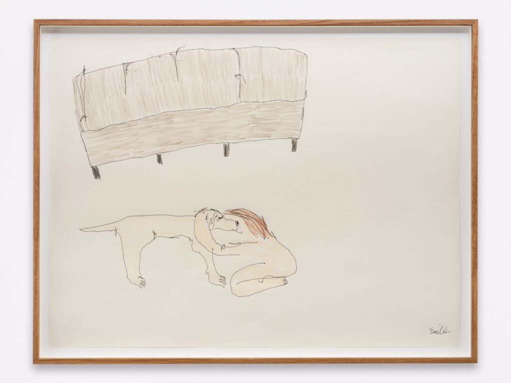 "Holding On (with couch)" is a colored drawing on white paper. The drawing is framed in oak. Created with ballpoint pen and crayon, the artwork shows a naked, pink-flesh-colored Emilie kneeling and hugging a standing London around her shoulders in the foreground. In the upper left corner, there is a grey couch.