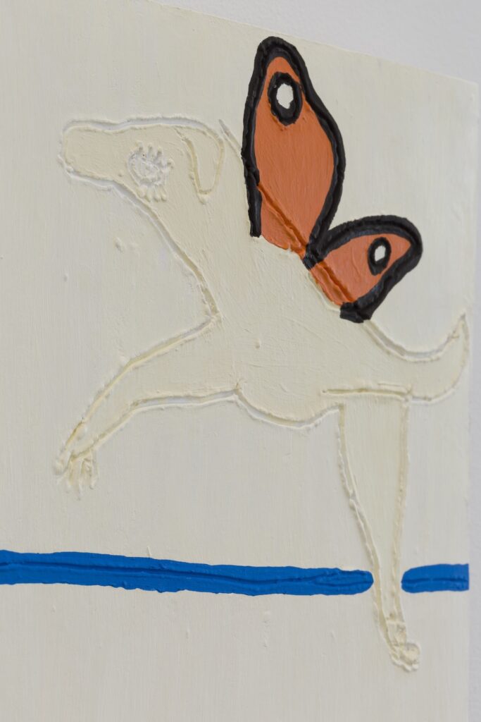 A detailed view of the right most butterflydog as she hovers above the ocean.