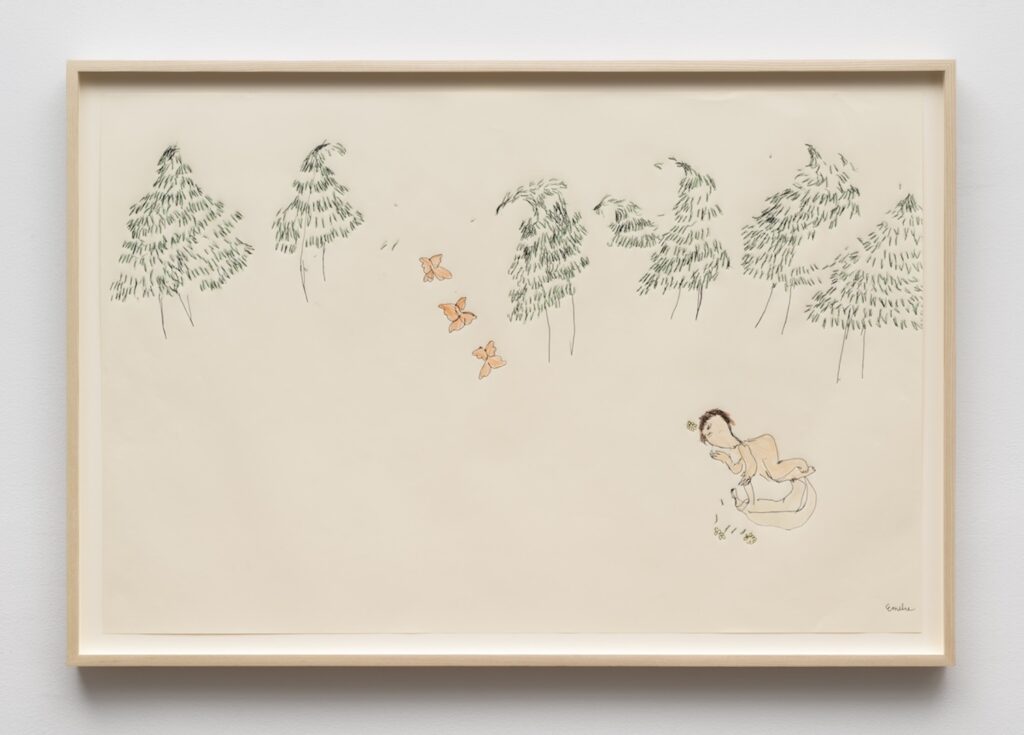 A cream-colored drawing paper in a light wooden frame. Along the upper third of the page, a loose row of slender pine trees are drawn with thin black trunks and sketchy green pine needles that look as though they are being blown through the wind. Near the center of the page, four small orange butterflies are scattered diagonally, as if fluttering from the trees toward the lower right. In the lower right corner, Emilie is shown lying down on the forest floor, curled up next to London. Their eyes are closed and their hands are clasped near their faces. A few tiny yellow flowers are drawn around their heads and around their bodies, suggesting a quiet, resting or dreaming moment.