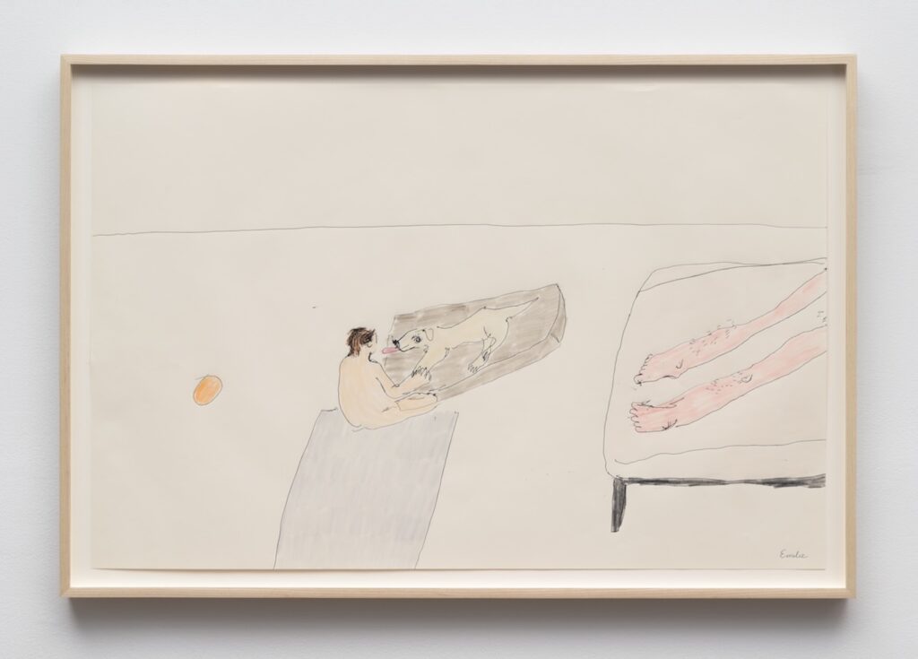 A framed drawing on off-white paper with simple, childlike lines and soft colors. In the lower center, Emilie with short brown hair sits on a pale gray rectangular surface, facing right towards London who is lying in her brown bed. London leans towards Emilie, licking their face with a long pink tongue. To the right, there is a pale pink bed shown from above, with four thin dark legs. On the bed are Kirby’s very hairy legs stretching diagonally from the upper right toward the center. At the bottom left on the floor next to Emilie, is a small orange ball floating alone against the empty background.